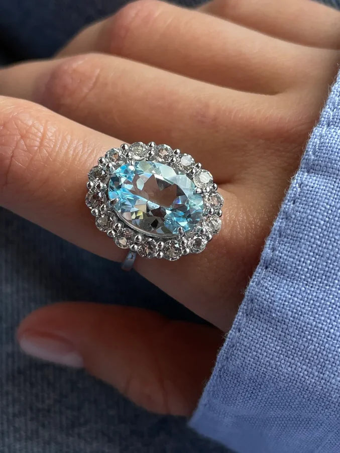 Oval cut blue topaz ring